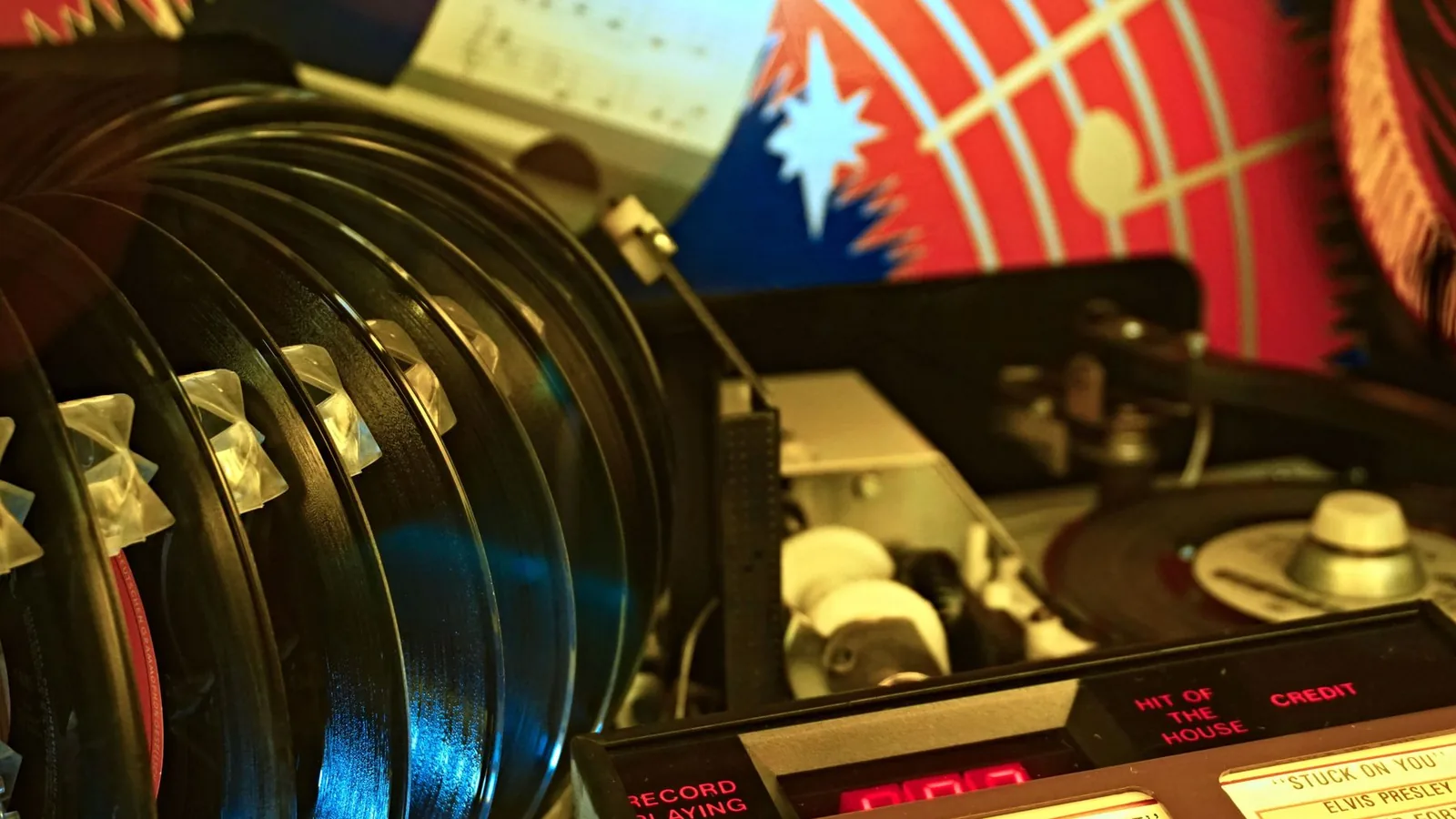 Vinyl records beside a mixer