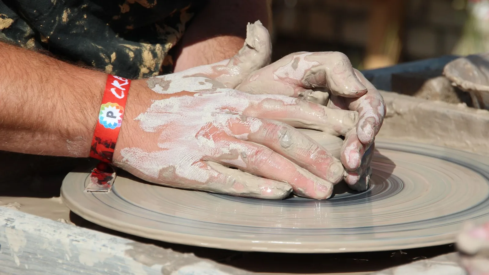 Hands playing a hand drum