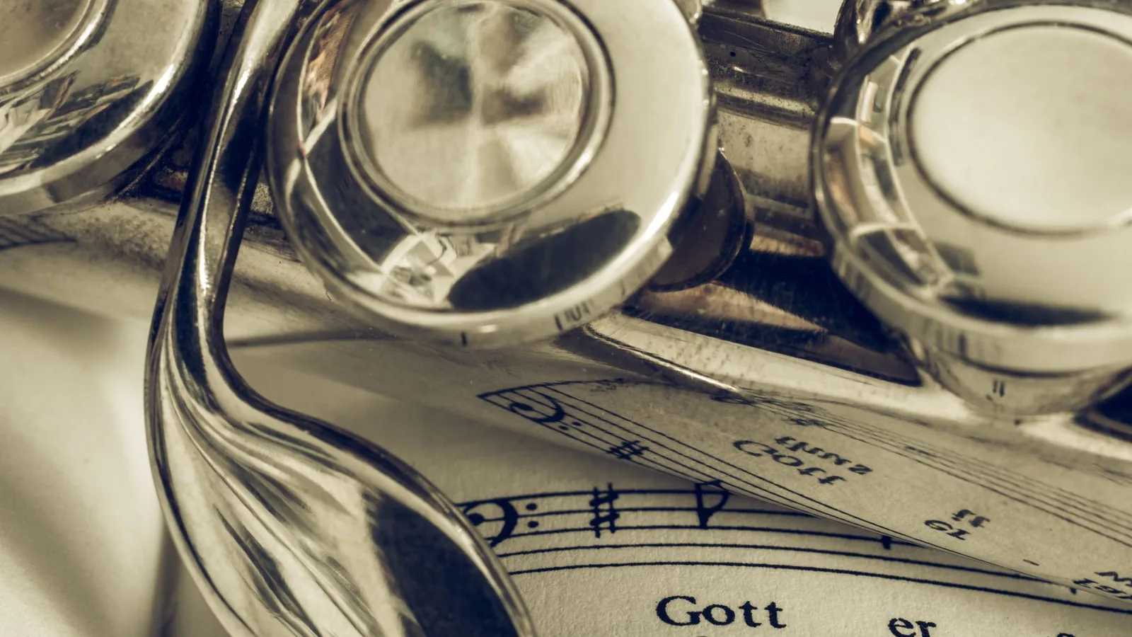 A trumpet resting on sheet music