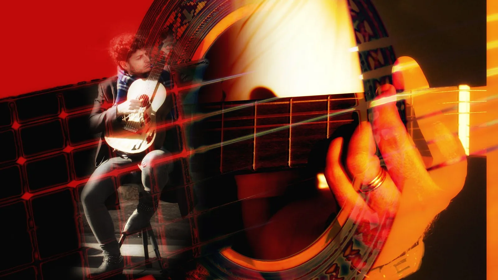 A guitarist lit in red