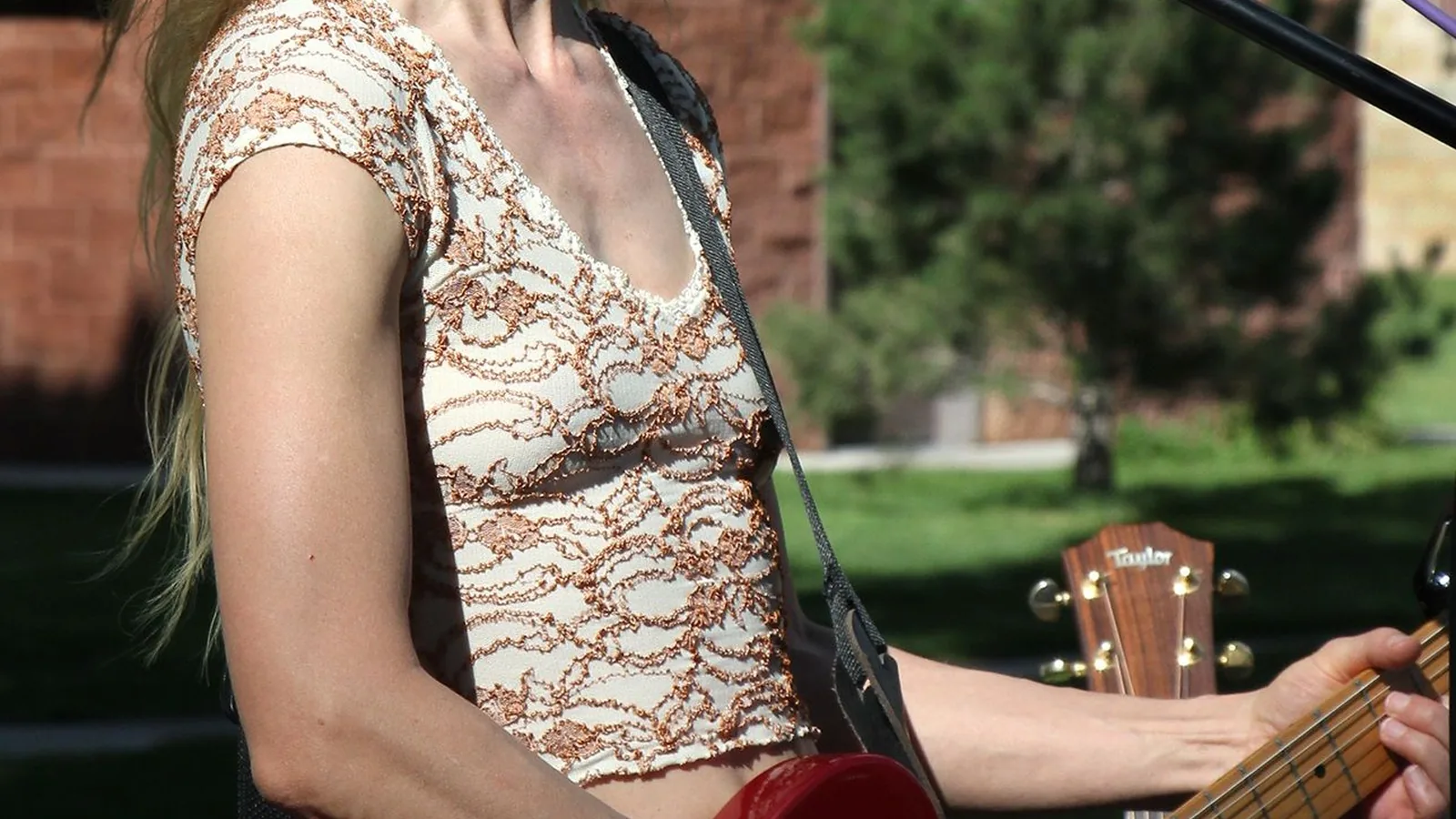 A woman playing guitar
